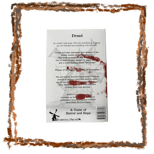 Back cover of a book titled 'Dread' with text and a logo, framed with decorative brown border.