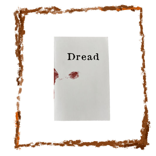 Book with 'Dread' on the cover, surrounded by a brown decorative border.