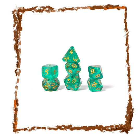 Set of green polyhedral dice with gold numbers on a white background