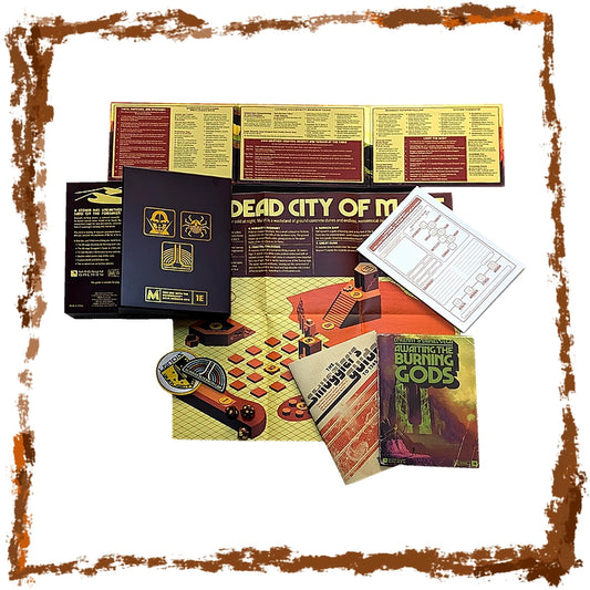 A tabletop layout of a board game set with multiple components arranged on a white background: a folded game board, rulebook pages, a dark blue box, a white instruction sheet, a small booklet, and a book titled 'The Ultimate Burning Gods.' No people or real environment are present, so this is Product/Packaging rather than Lifestyle.
