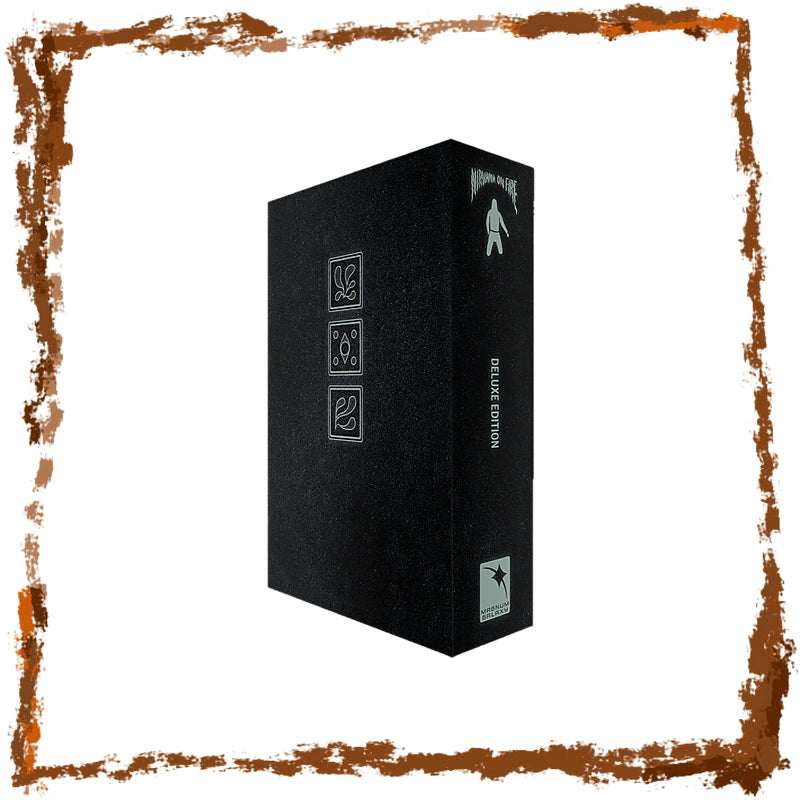 A tall black rectangular box with silver-gray printed icons and vertical text reading 'Deluxe EDITION' on the spine, shown on a white background with a distressed brown border around the edges.